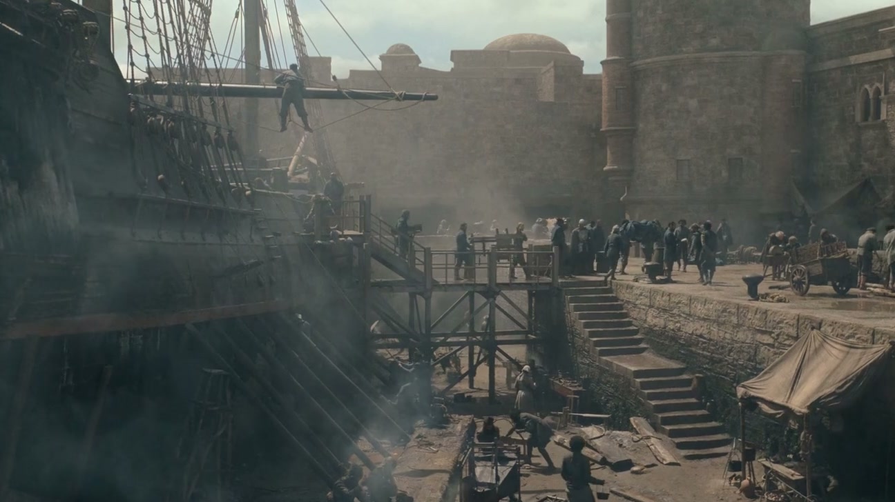 A smoky quayside below fortress walls, a ship moored at the steps