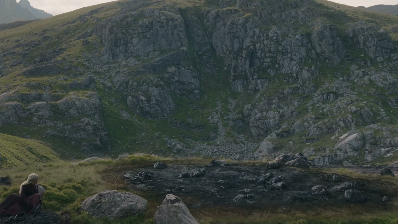 A broad green mountain face above an empty moor
