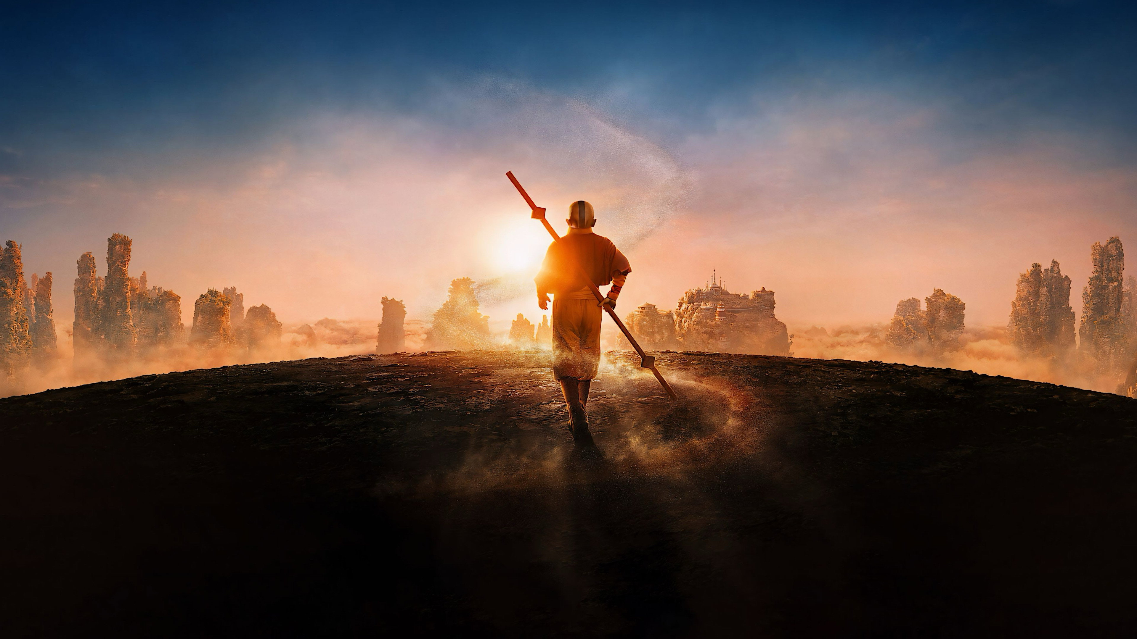 Avatar: The Last Airbender: a figure walking a misty plain of rock spires at sunrise, official series art
